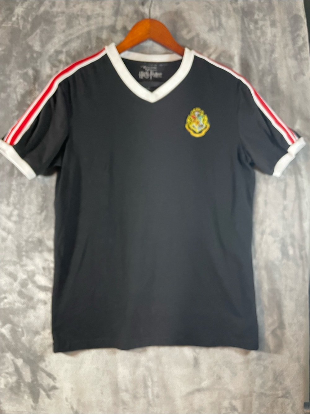 Warner Bros. Black V-Neck Tee with Red & White Trim and Crest